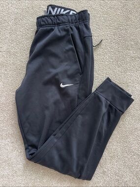 Nike Black men’s medium Training Joggers with White Swoosh